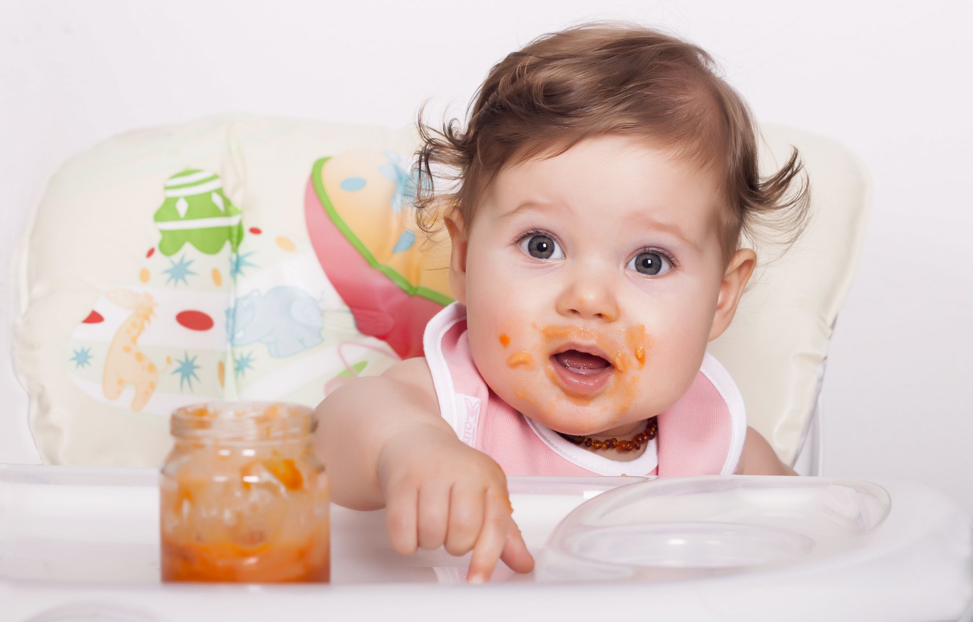 adorable-smudgy-female-baby-eating-her-favorite-food