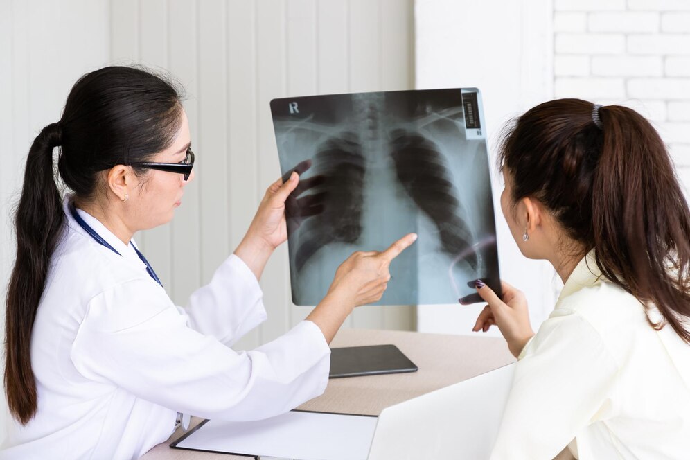 medical-doctor-give-consultation-patient-with-xray-film_554837-566